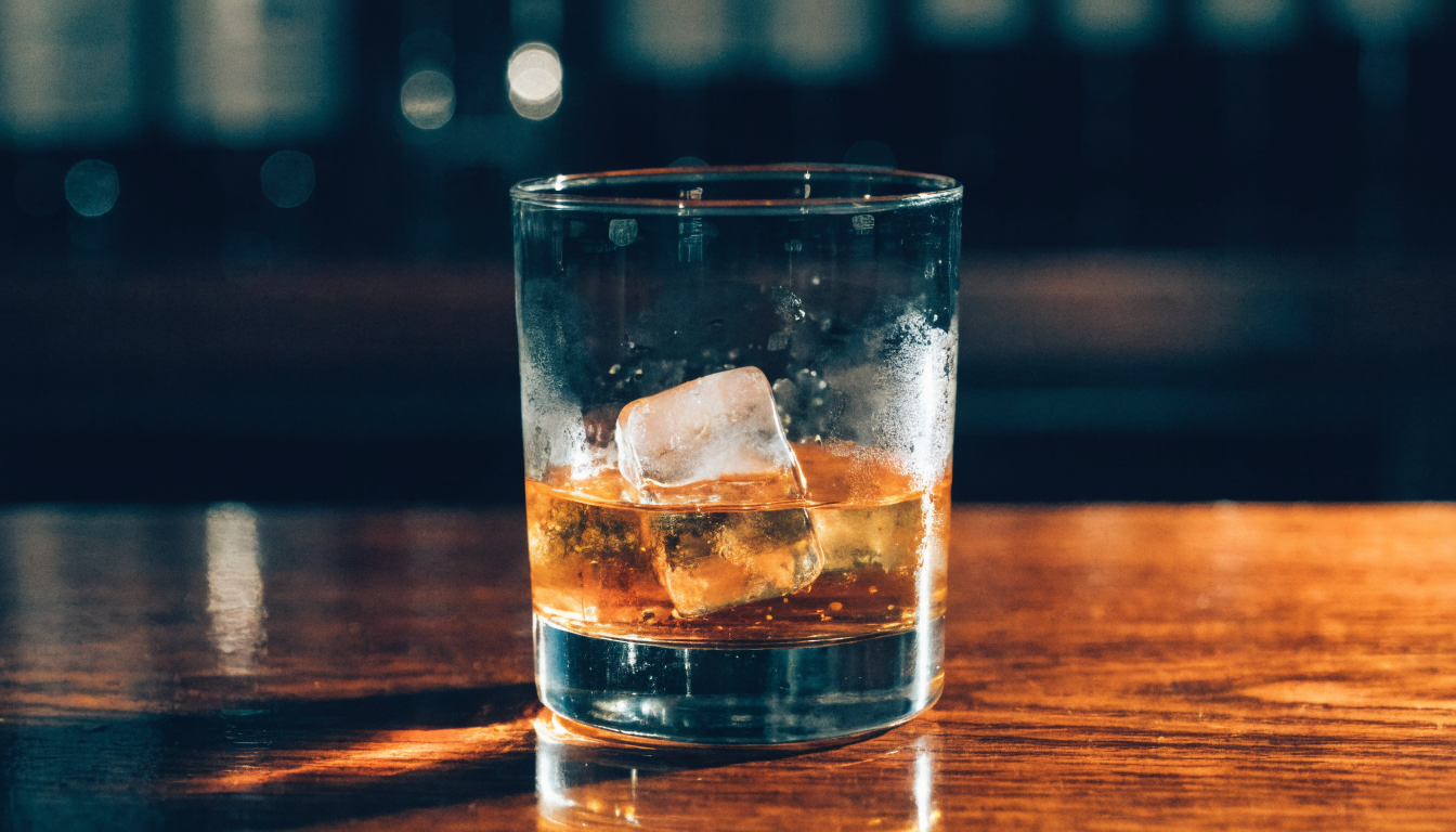 Close-up of hands editing video clips on a tablet in warm studio light